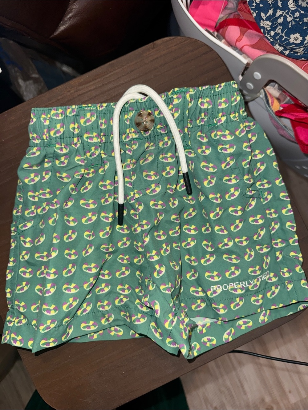 Properly tied Shorts with king cake- Mardi Gras